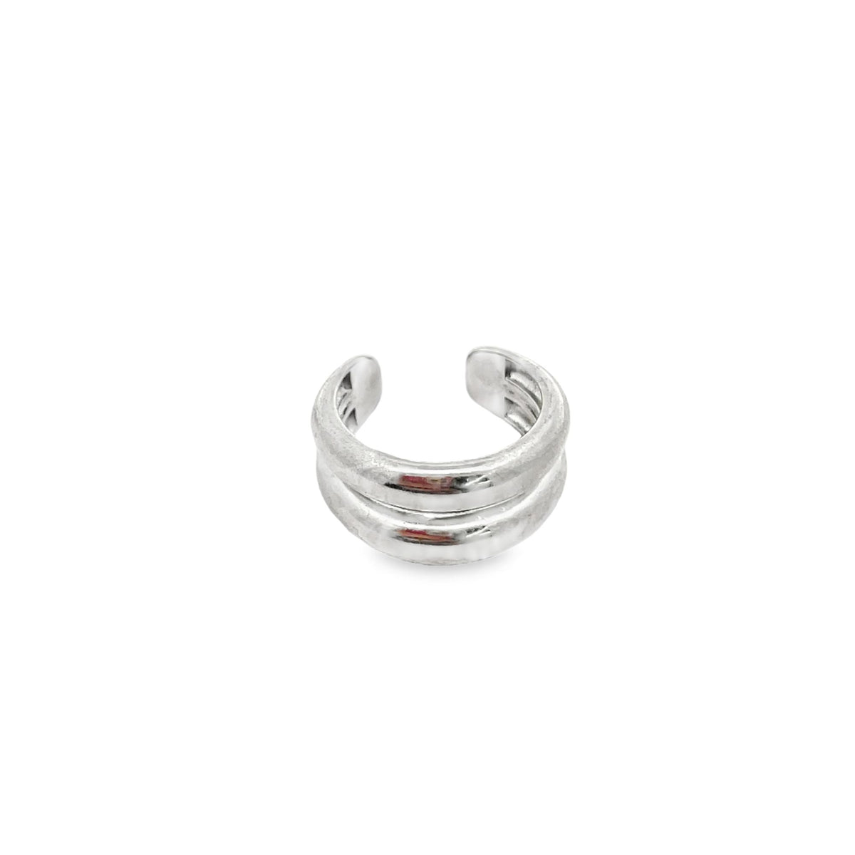 A polished silver double-band ear cuff sits isolated on a white background.