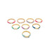 Seven colorful enamel gold rings with sparkling cubic zirconia bows rest on a clean white surface.
