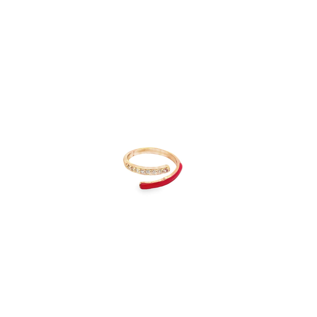 A gold bypass ring features a sparkling row of diamonds on one end and a vibrant red enamel accent on the other.