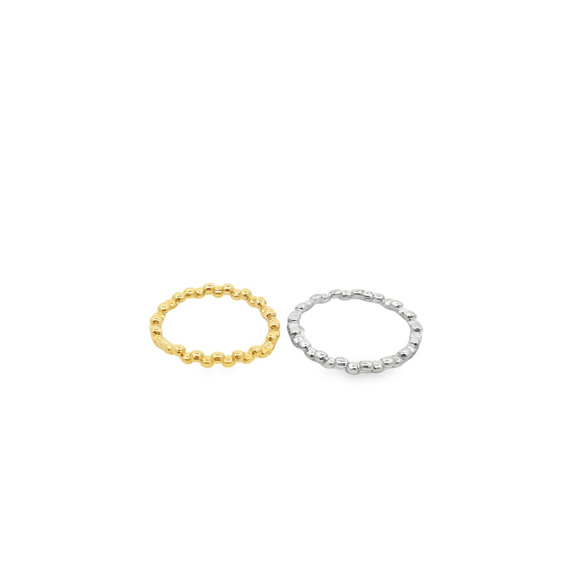 A gold beaded ring and a silver beaded ring rest side by side against a clean white background.