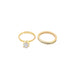 Two elegant gold diamond rings sit side by side against a clean white background.