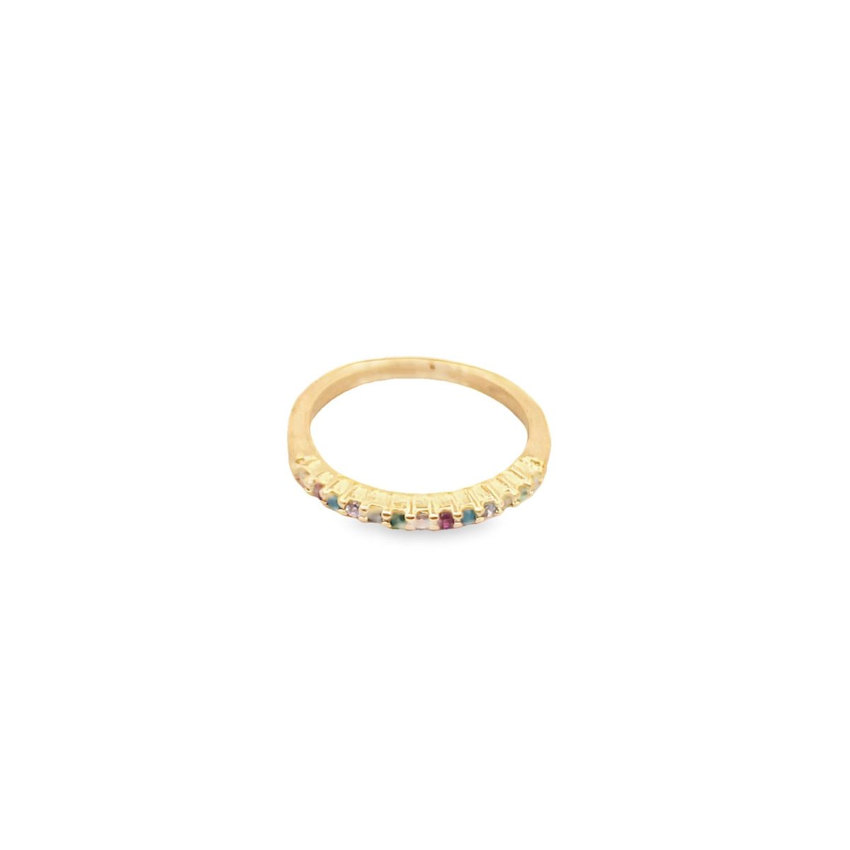 A delicate gold band ring features a row of small, colorful gemstone accents.