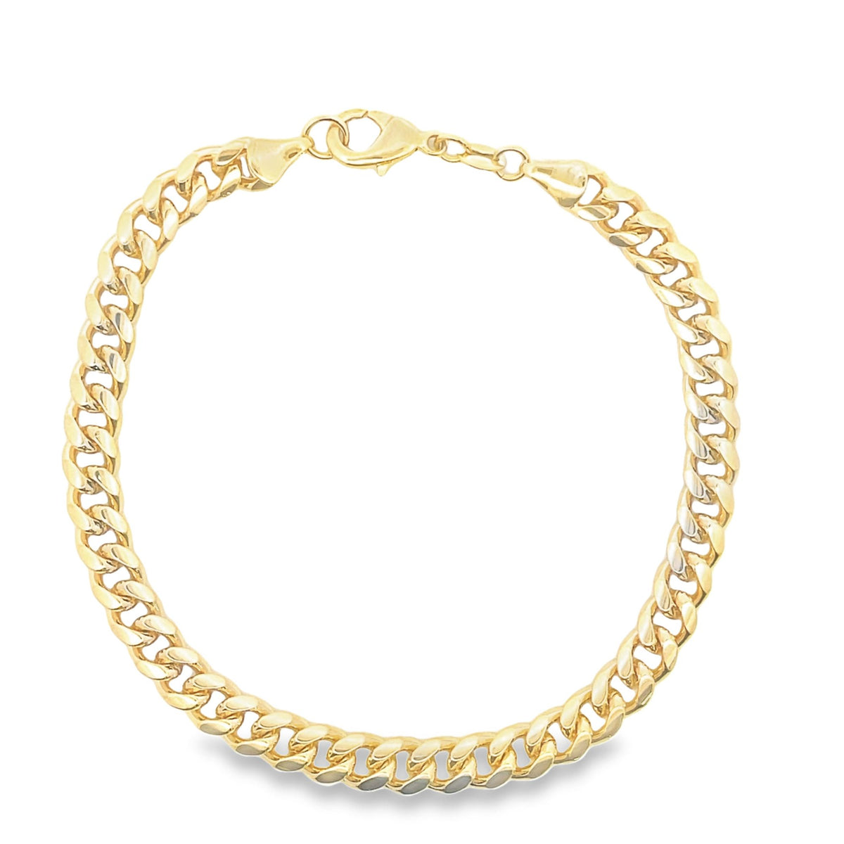 A polished gold cuban link bracelet curves gracefully against a plain white background.