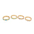 Four gold heart-patterned rings with colorful enamel and cubic zirconia accents sit in a row on a white background.
