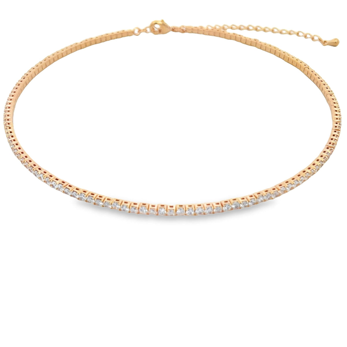 A gold tennis choker necklace featuring a continuous line of sparkling square-cut cz stones rests flat against a white background.