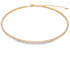 A gold tennis choker necklace featuring a continuous line of sparkling square-cut cz stones rests flat against a white background.