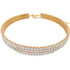 A double-row gold tennis bracelet sparkles with embedded diamonds against a plain white background.