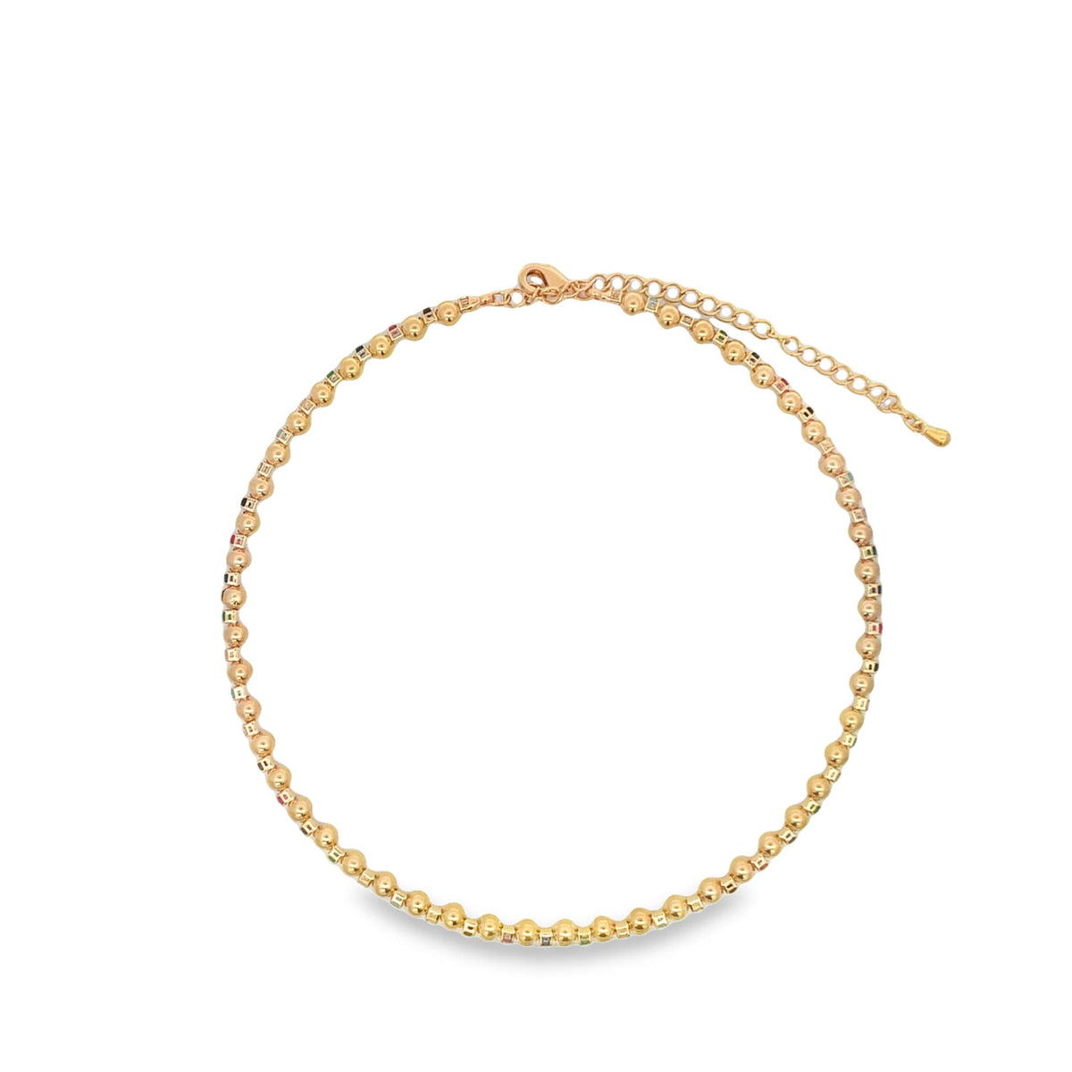 A delicate gold beaded necklace sparkles against a clean white background.