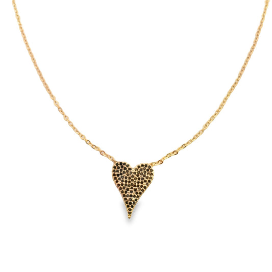 A delicate gold chain necklace features a pavé-set black crystal heart pendant against a white background.