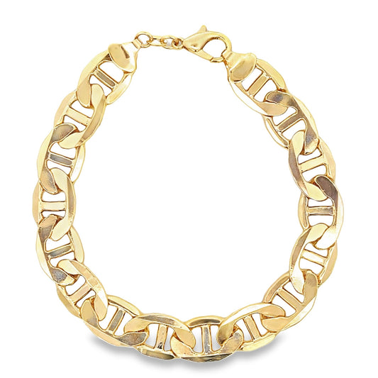 A polished gold Mariner link bracelet curves against a clean white background.