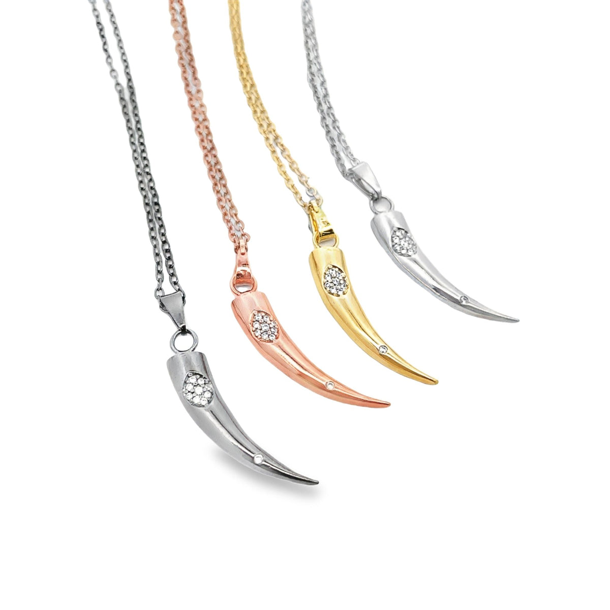 Four delicate horn pendants in silver, rose gold, yellow gold, and platinum hang from matching chains, each sparkling with inlaid cubic zirconia crystals.