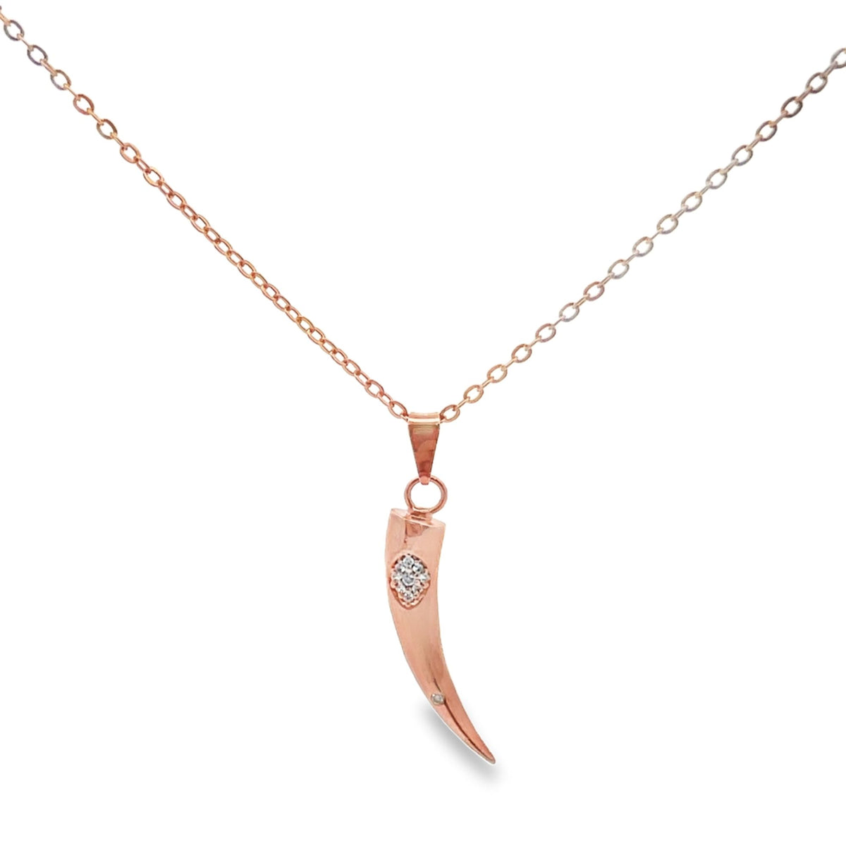 A delicate rose gold horn pendant necklace features a small, sparkling diamond accent embedded near the top.
