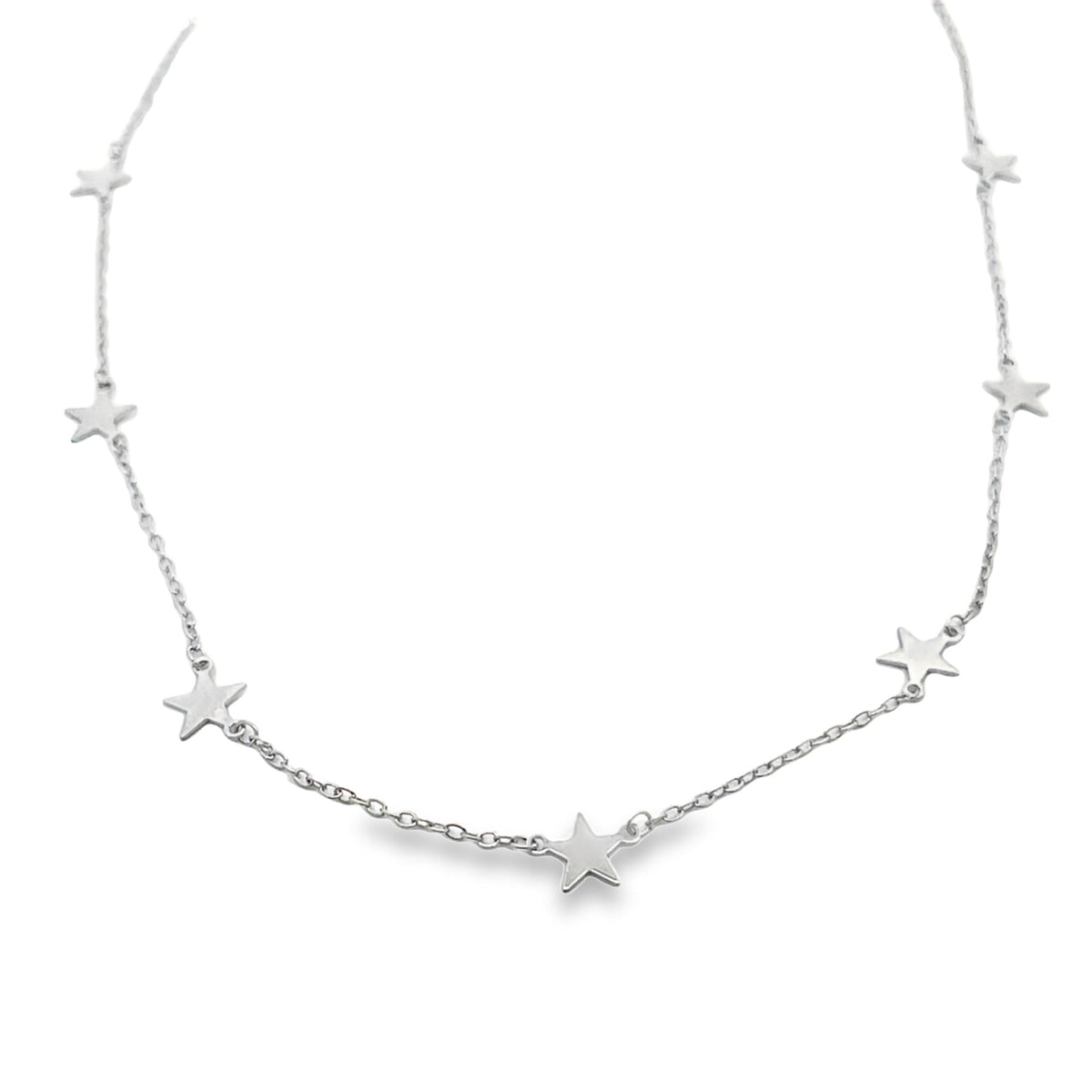 A delicate silver star-charm choker necklace hangs against a plain white background.