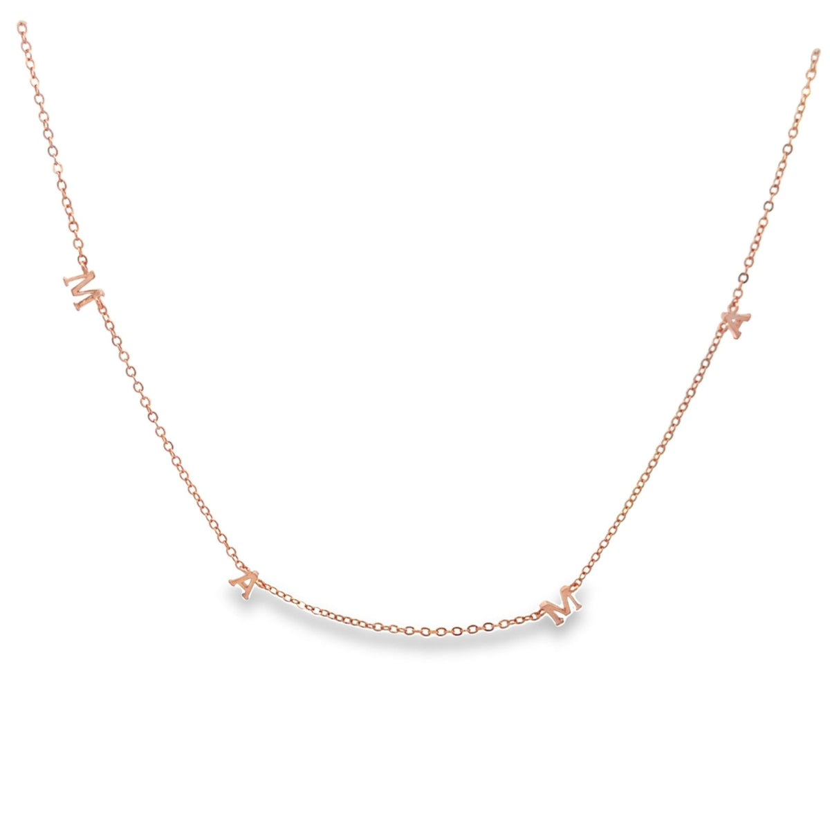 A delicate rose gold MAMA letter necklace drapes against a clean white background.