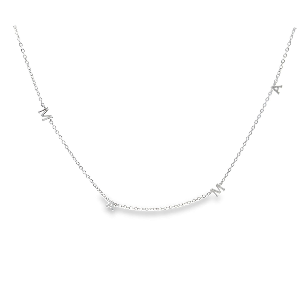 A delicate silver chain necklace spells out the word MAMA with individual letter charms.