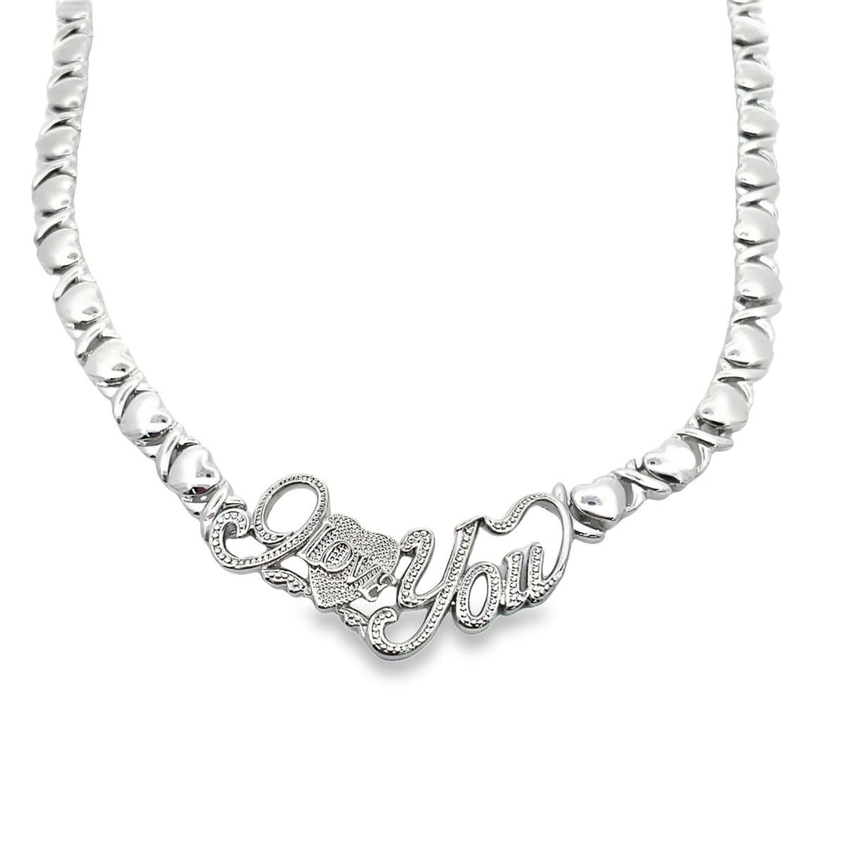 A gleaming silver necklace features an "I Love You" pendant adorned with sparkling diamond accents amidst a linked heart chain.