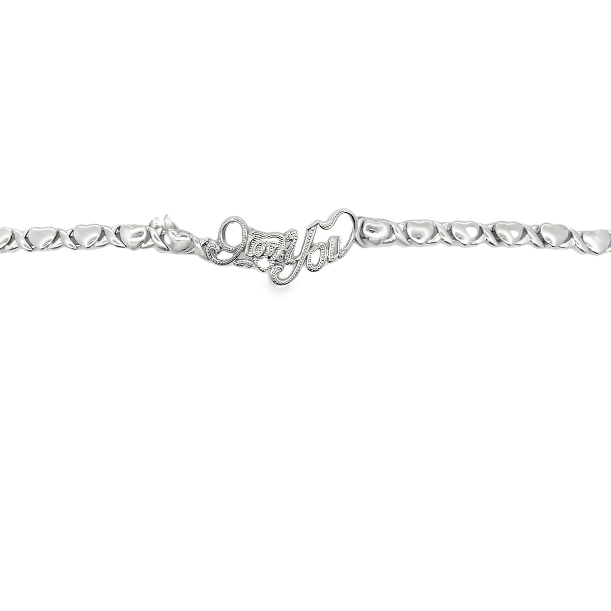 A sterling silver tennis bracelet features alternating heart and cross links centered around a cursive "I Love You" centerpiece.