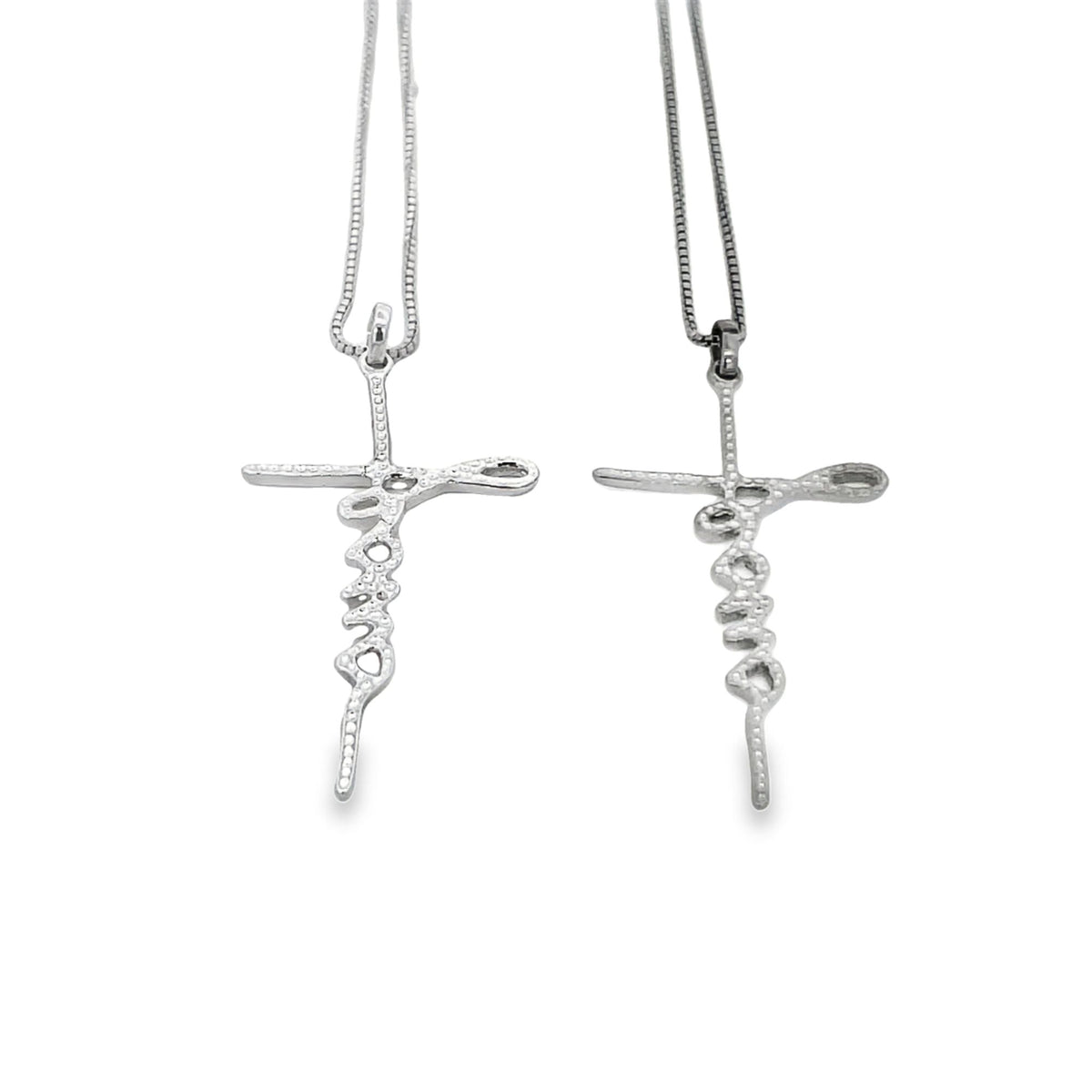 Two silver cross necklaces featuring the word faith hang side by side against a white background.