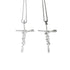 Two silver cross necklaces featuring the word faith hang side by side against a white background.