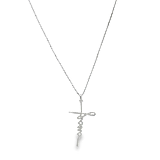 A silver chain necklace features a delicate pendant shaped like the word faith in cursive, forming a subtle cross against a plain background.