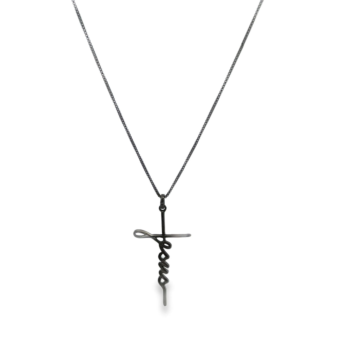 A dark metal cross necklace features a pendant shaped like the word Jesus in script lettering against a plain white background.