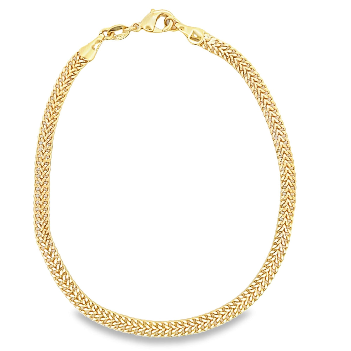 A delicate gold wheat chain necklace gleams against a white background, featuring an intricate braided design and a secure lobster clasp.
