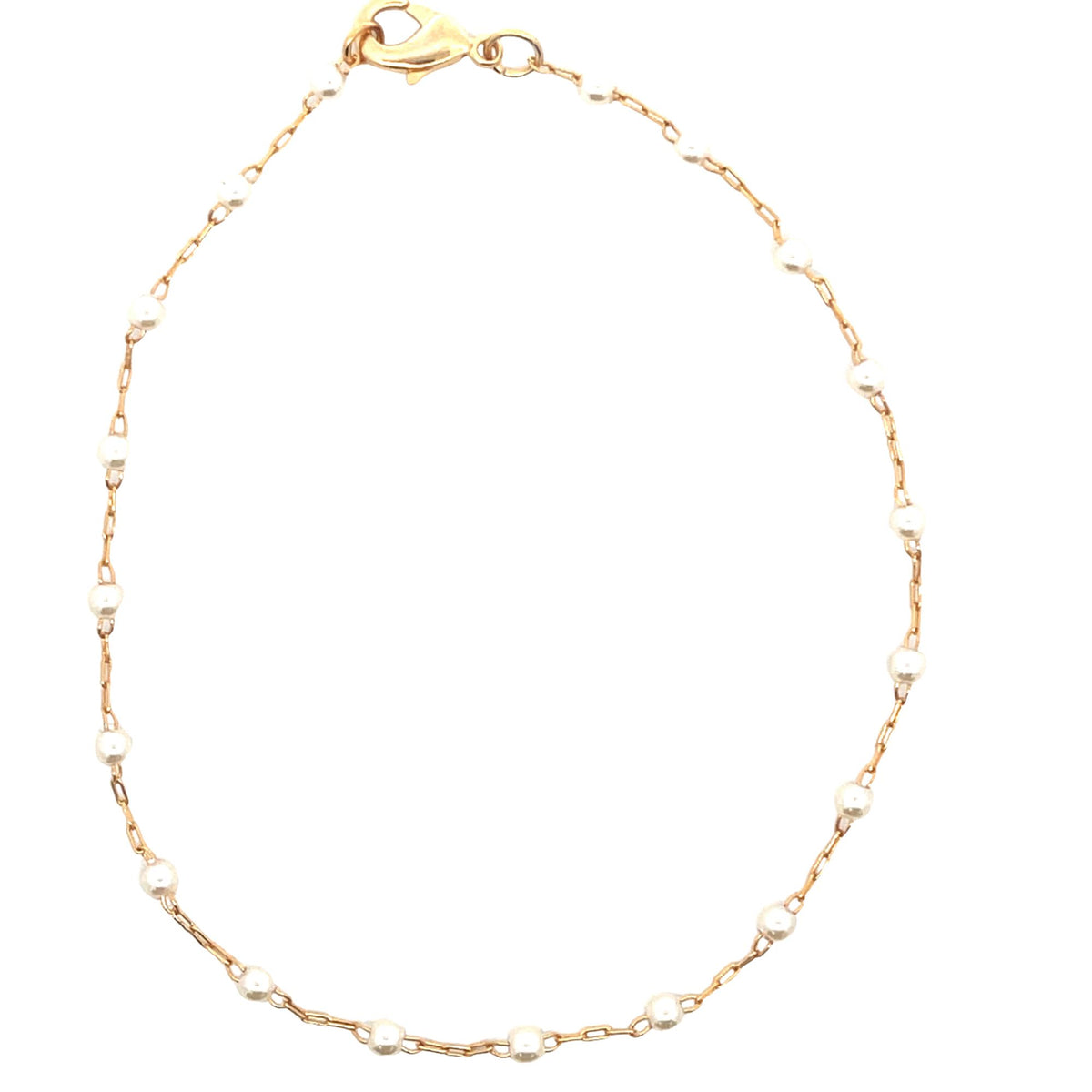 A delicate gold chain bracelet features evenly spaced small pearls against a plain white background.