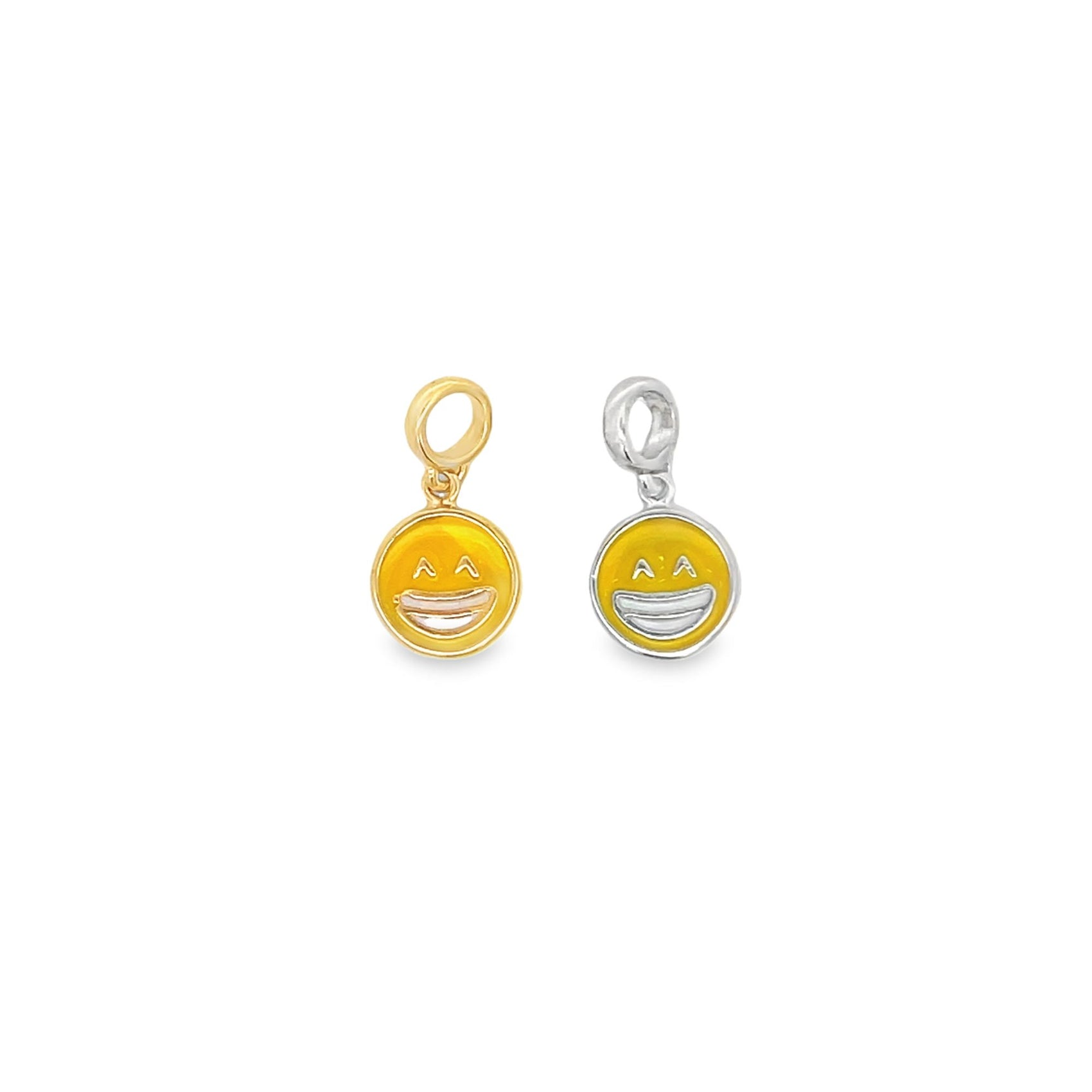 A gold and a silver smiling face emoji charm feature yellow enamel details against a white background.