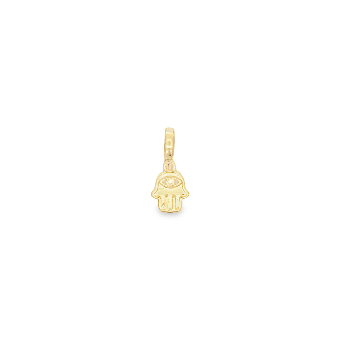A delicate gold Hamsa hand charm features an engraved evil eye symbol with a tiny sparkling diamond in the center.