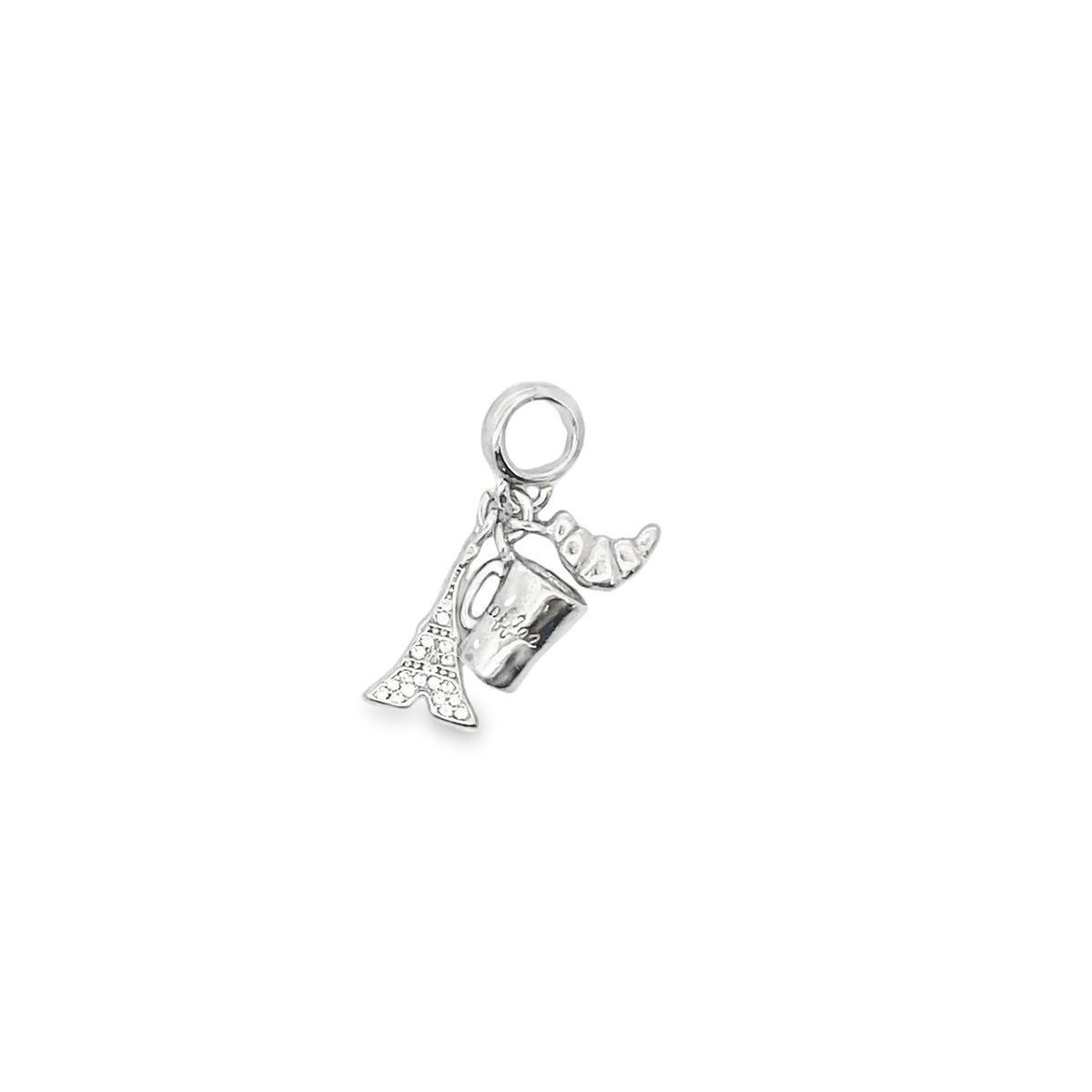 A sparkling silver charm features miniature dangling pendants of the Eiffel Tower, a coffee cup, and a croissant against a plain white background.