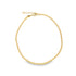 A gold bead chain anklet rests in a complete circle on a clean white background.