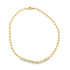 A polished yellow gold ball chain necklace lies in a circular shape against a clean white background.