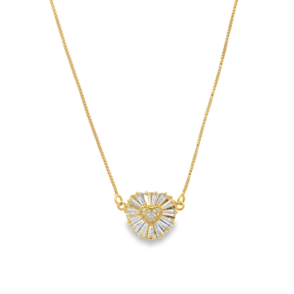 A delicate gold chain necklace features a sparkling diamond-encrusted heart pendant centered against a clean white background.