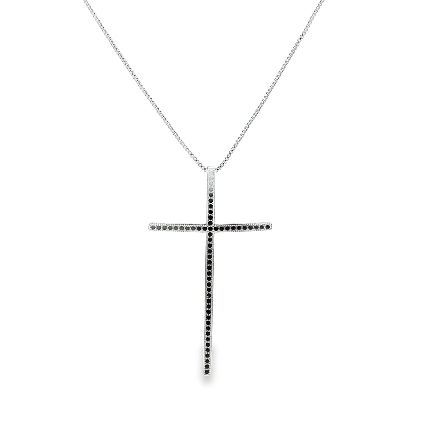 A silver cross pendant necklace encrusted with black diamonds hangs from a delicate box chain.