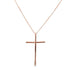 A rose gold cross pendant necklace featuring inlaid black diamonds hangs against a plain white background.