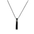 A sleek black bar pendant inscribed with the word "LOVE" hangs delicately from a matching dark chain necklace.
