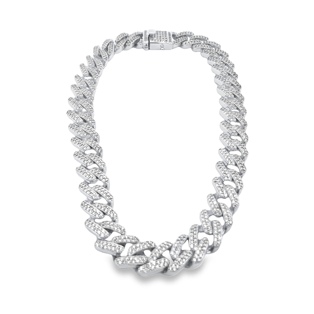 A gleaming white gold diamond cuban link chain rests in a circular shape against a white background.