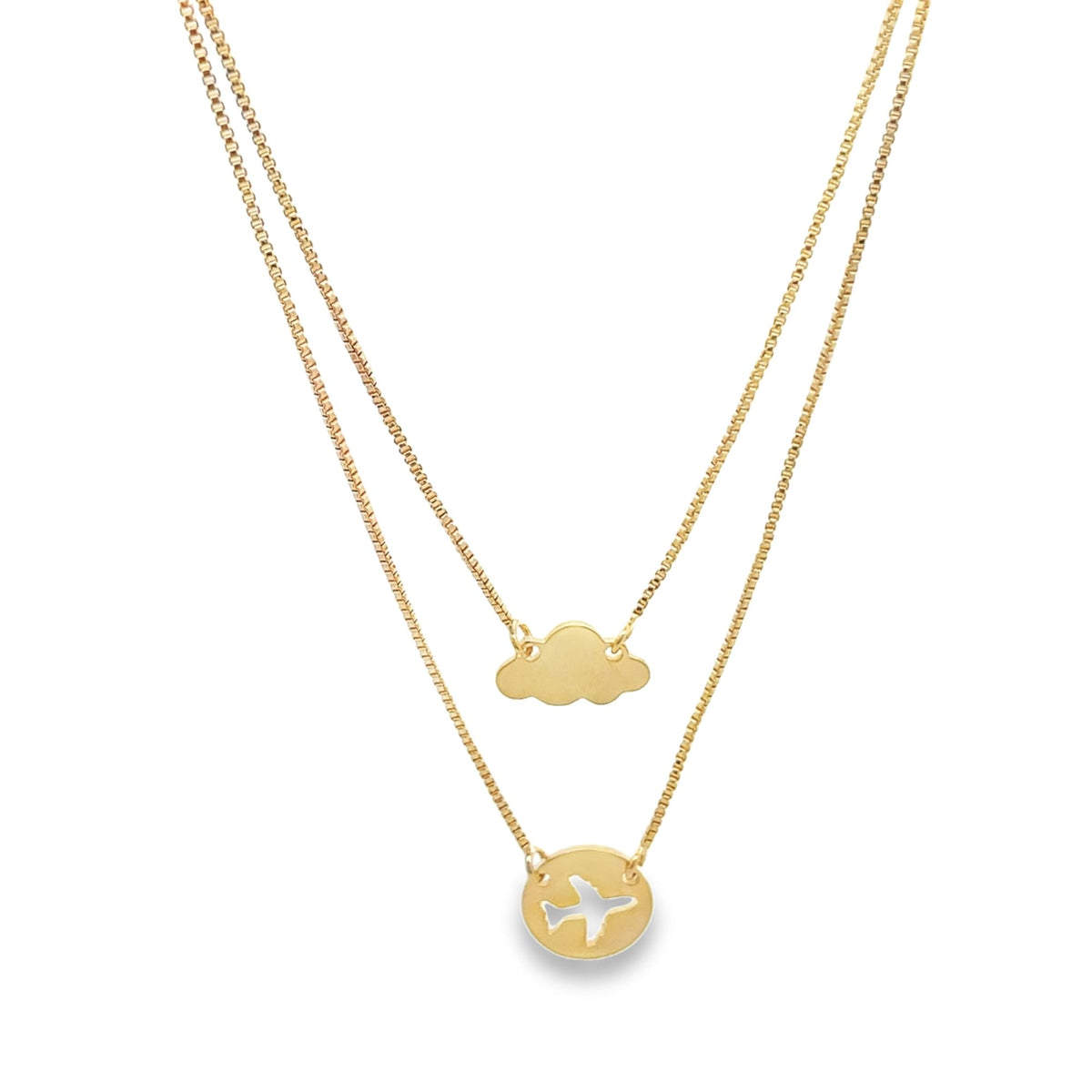 A gold layered necklace features a cloud pendant on the shorter chain and an airplane cutout pendant on the longer chain.