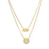 A layered gold necklace features a cloud pendant on the shorter chain and a cutout airplane pendant on the longer chain.