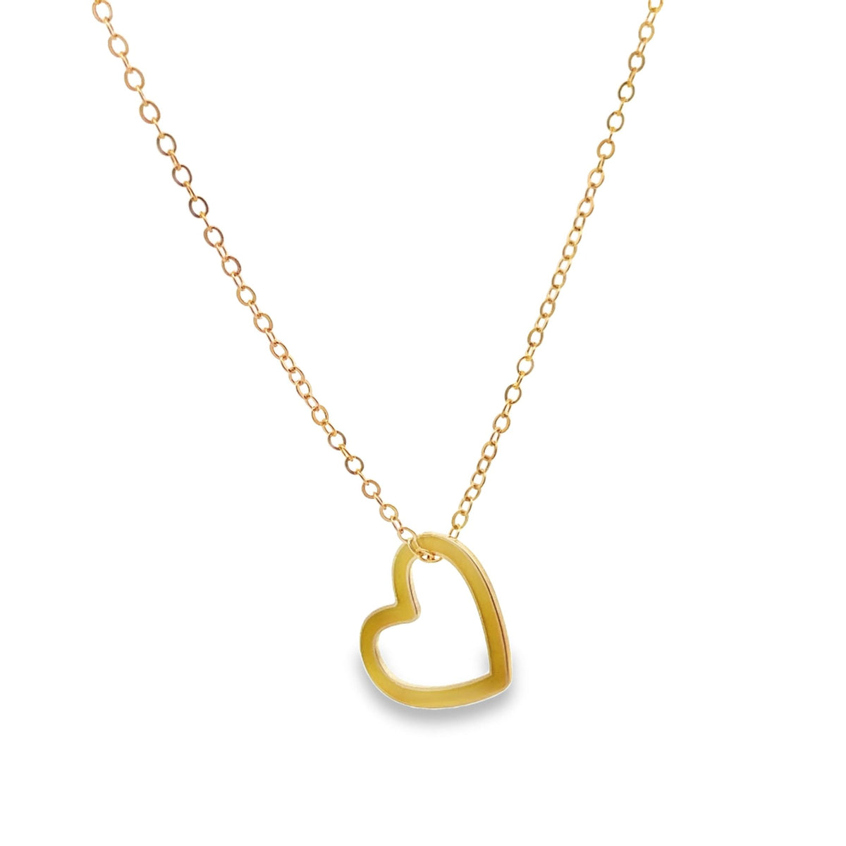A delicate gold chain necklace dangles with an open-work heart pendant against a white background.