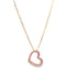 A delicate gold chain necklace hangs against a white background, featuring a glossy pink enamel heart pendant.