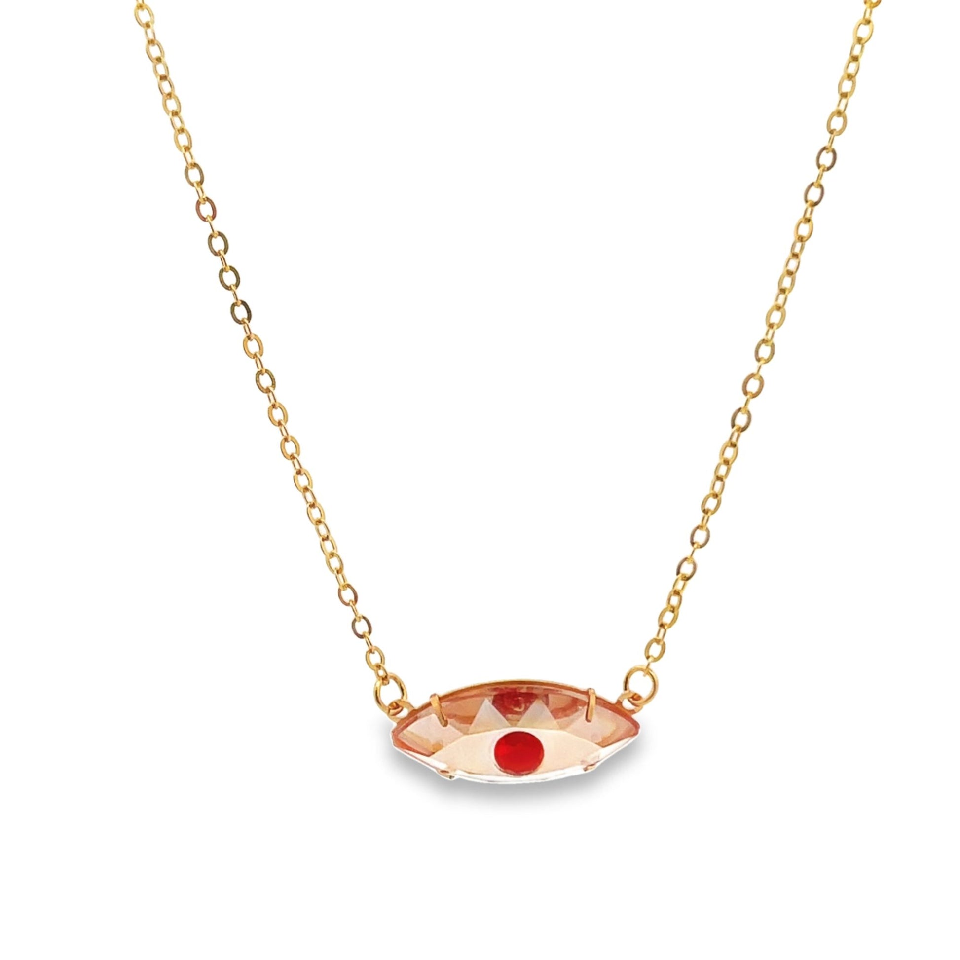 A delicate gold chain necklace features a unique evil eye pendant crafted with peach crystal and a bright red center stone.