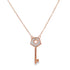 A rose gold key pendant necklace featuring a pentagon-shaped head encrusted with sparkling diamonds and a cutout star in the center hangs against a plain white background.