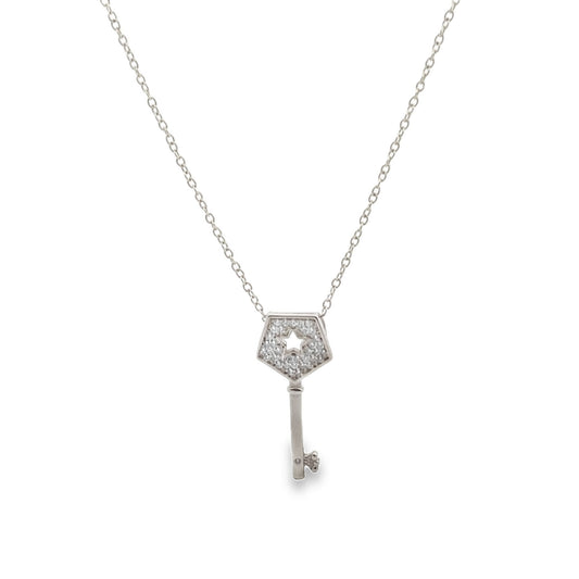 A delicate silver chain necklace features a pavé-set diamond key pendant with a star-shaped cutout.
