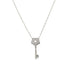 A delicate silver chain necklace features a pavé-set diamond key pendant with a star-shaped cutout.