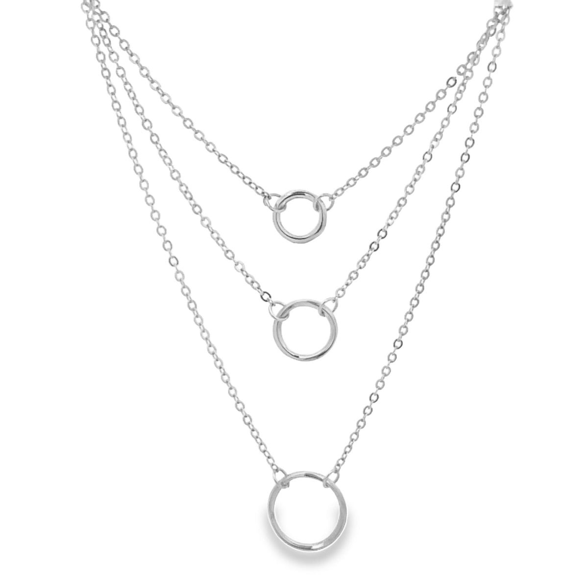 A layered silver necklace features three delicate chains with matching circular pendants suspended at varying lengths.