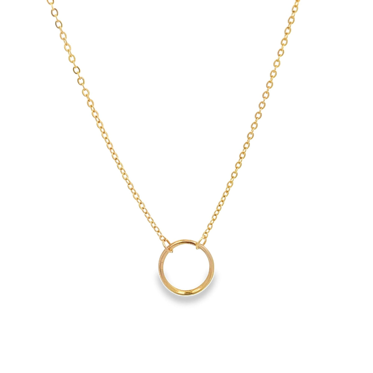 A delicate gold circle pendant hangs gracefully from a matching chain necklace against a white background.