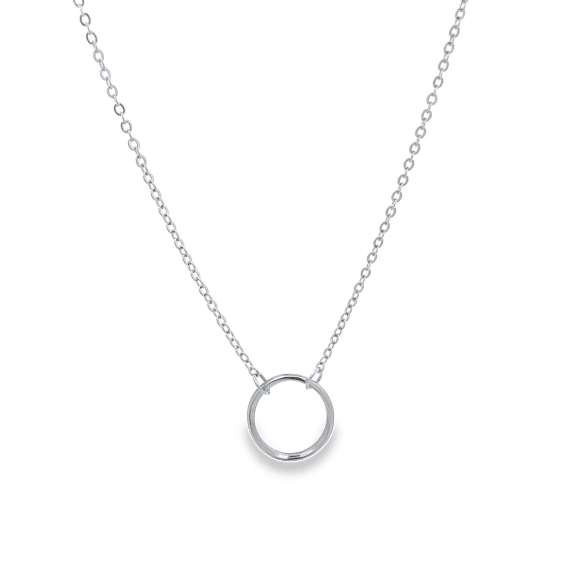 A delicate silver circle pendant hangs gracefully from a matching link chain necklace on a white background.