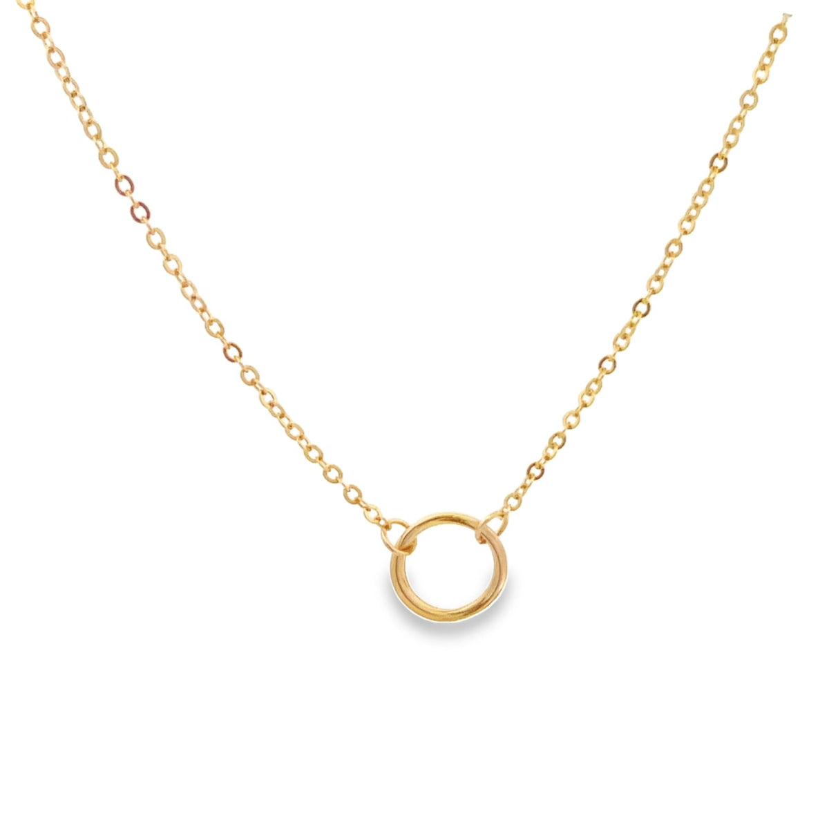 A delicate gold circle pendant hangs gracefully from a matching delicate gold chain necklace against a clean white background.