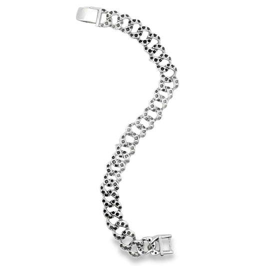 A silver Cuban link bracelet features embedded black stones arranged in a gentle curve against a white background.